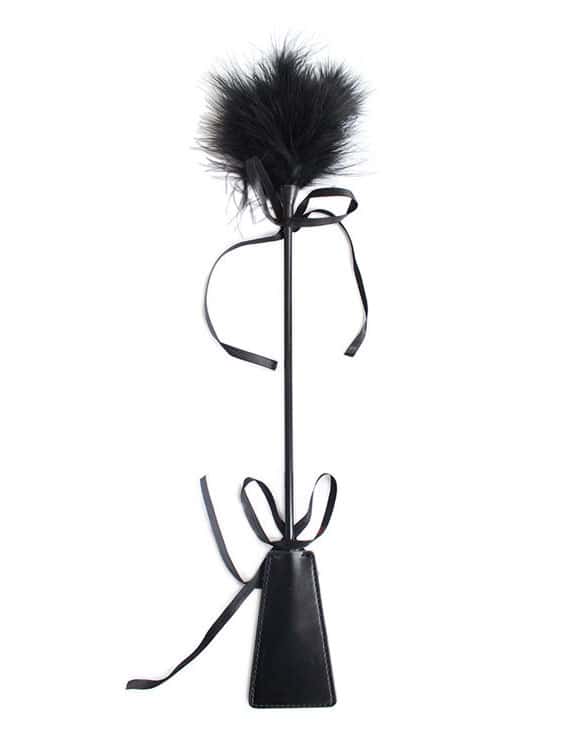 Unleash your desires with the Feather Lingerie Riding Crop, an essential addition to your collection of intimate accessories.