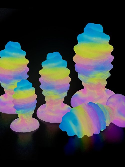 A glow-in-the-dark silicone anal plug, designed for safe and pleasurable use, with a smooth finish and a subtle light emitting feature