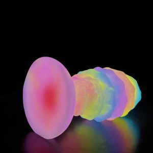 A glow-in-the-dark silicone anal plug, designed for safe and pleasurable use, with a smooth finish and a subtle light emitting feature