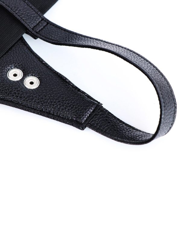 Black Strap-On Harness with steel rings designed for enhanced support and a bold aesthetic in intimate wear