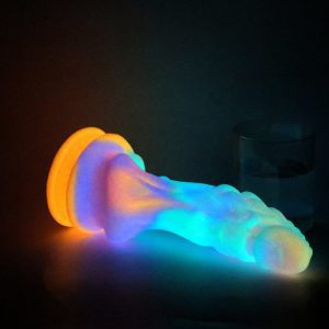 A glowing, uniquely shaped monster dildo designed for adventurous pleasure.