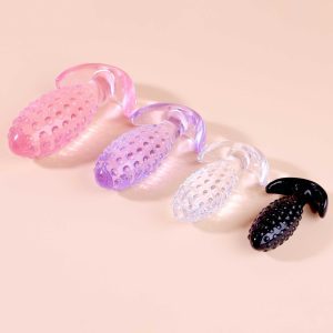 Transparent anal plug shaped like a pineapple, combining a playful design with smooth contours for a unique and enjoyable experience