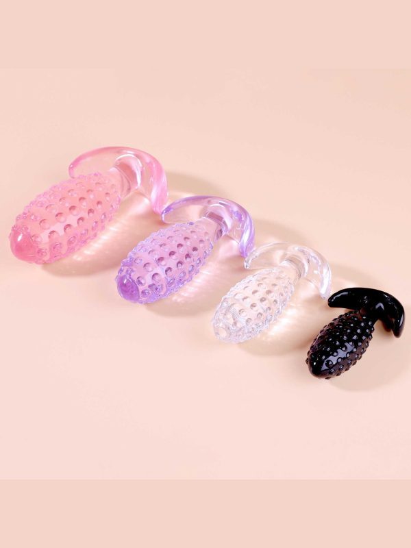 Transparent anal plug shaped like a pineapple, combining a playful design with smooth contours for a unique and enjoyable experience