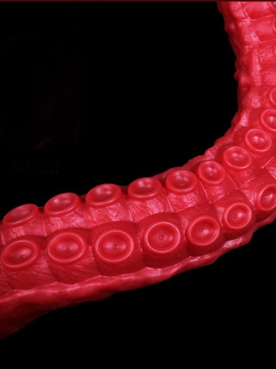 A red tentacle-shaped anal plug designed for enhanced pleasure and exploration