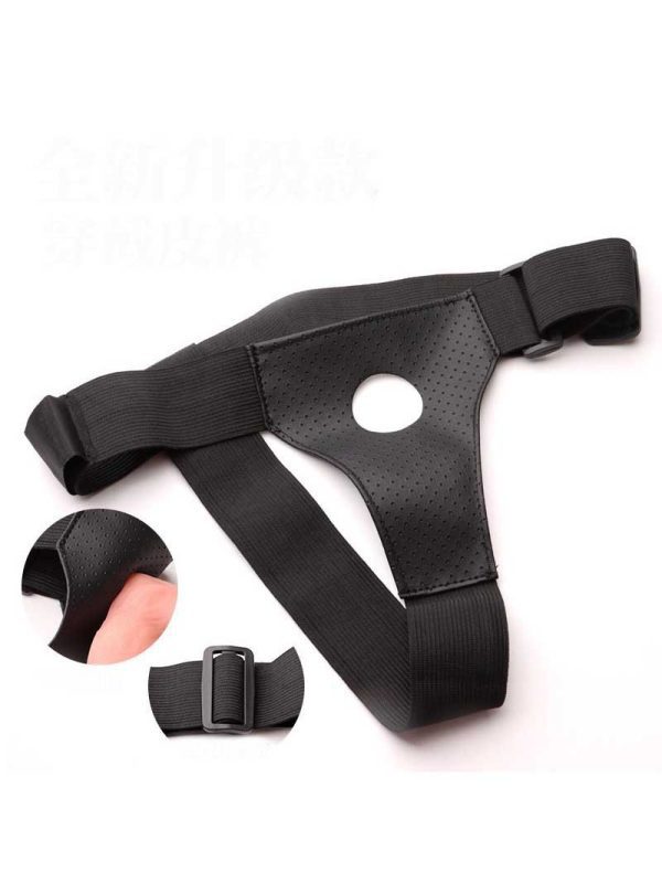 Black strap-on harness with a single opening for versatile use.