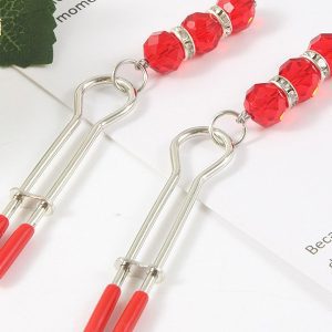 Elegant nipple clip adorned with a sparkling pendant, showcasing a blend of luxury and sensuality