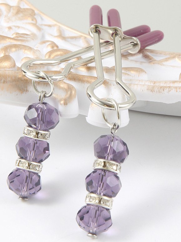 Elegant nipple clip adorned with a sparkling pendant, showcasing a blend of luxury and sensuality