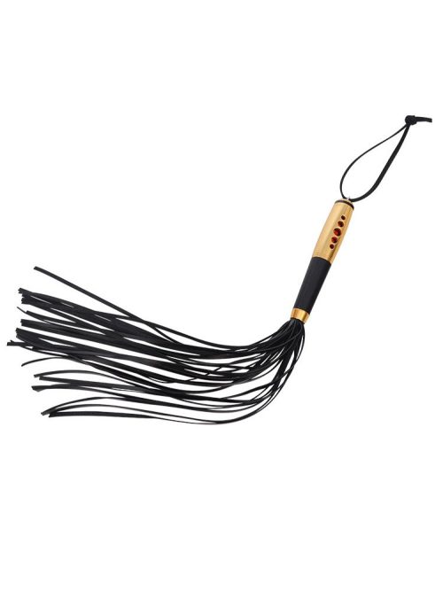 A whip featuring a gold handle, designed for both style and performance in your intimate play