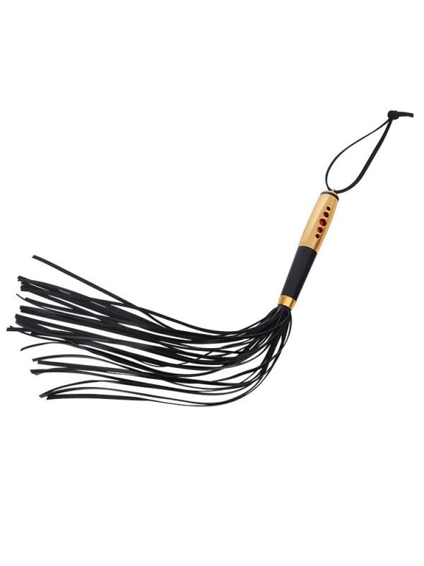 A whip featuring a gold handle, designed for both style and performance in your intimate play
