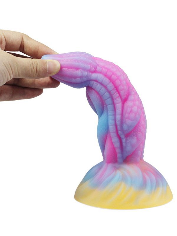 Pink dragon-shaped silicone dildo with intricate design and smooth texture