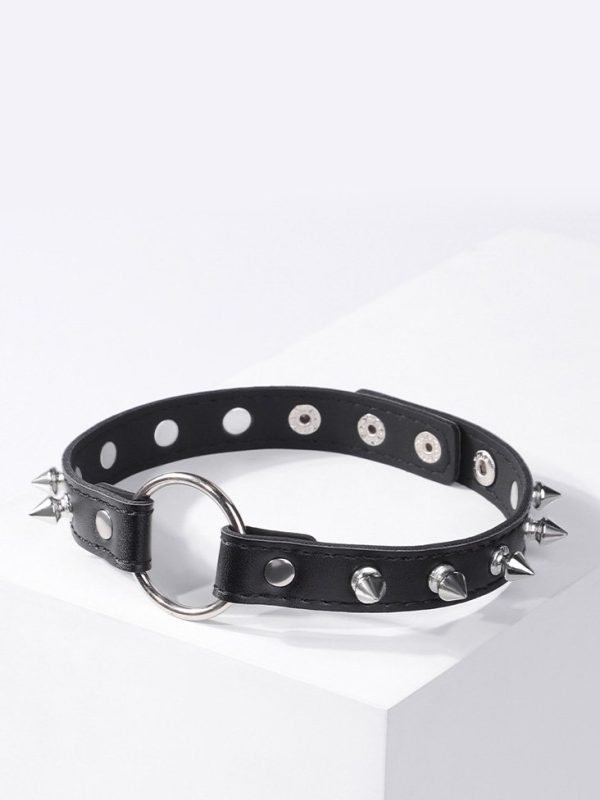 A black collar adorned with metal studs, showcasing a bold and edgy design